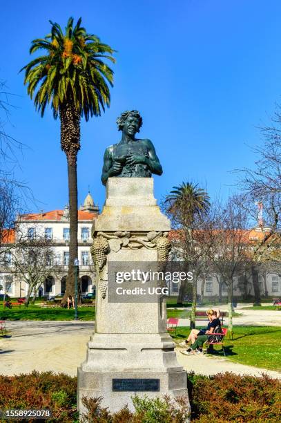 Porto, Portugal, Sculpture of Baco in the Square of the Portuguese Republic. Blue sky day in the famous place and tourist attraction.