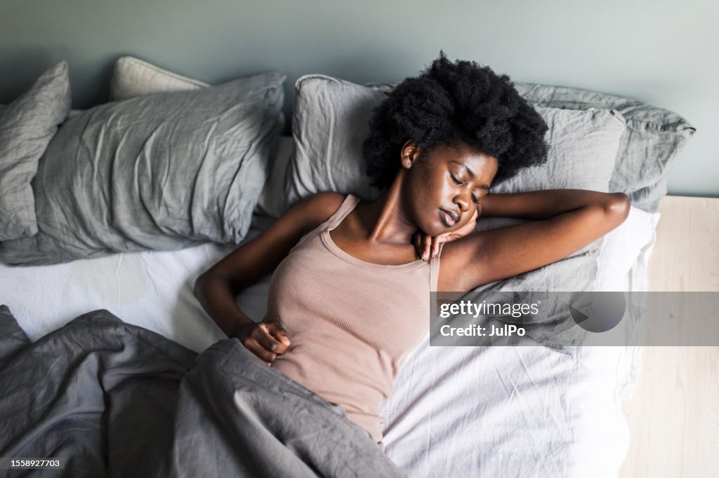 Young Adult Black Woman Sleeping In Bedroom At Home High-Res Stock Photo - Getty Images