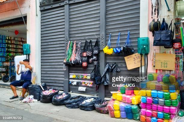 Rio de Janeiro, Brazil, Retail small business. One man working in the sidewalk.