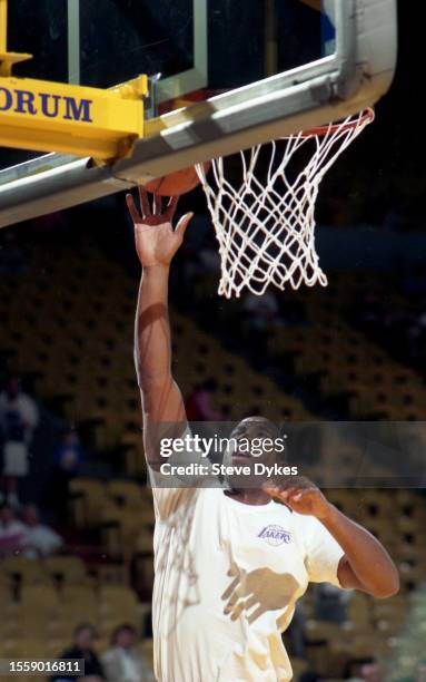 Earvin Magic Johnson of the Los Angeles Lakers warms up before an NBA Finals basketball game against the Chicago Bulls circa 1987 at the Forum in...