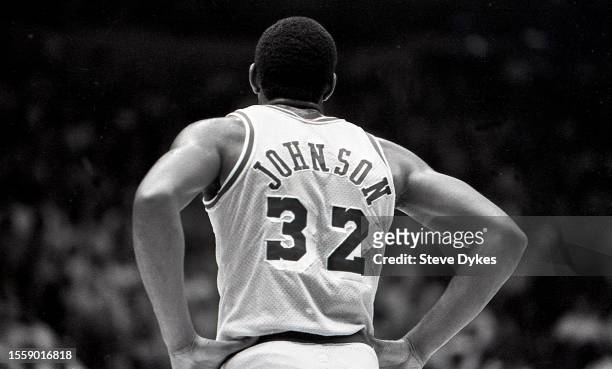 Earvin Magic Johnson of the Los Angeles Lakers looks on during an NBA Finals basketball game against the Boston Celtics circa 1987 at the Forum in...