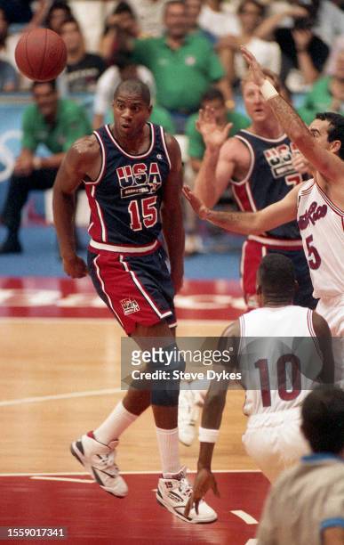 July 4, 1992: Earvin Magic Johnson passes the ball behind his back to Larry Bird of team USA during a game at the 1992 Summer Olympics against Puerto...