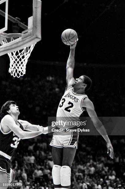 Earvin Magic Johnson of the Los Angeles Lakers drives to the basket against Kevin McHale the Boston Celtics during an NBA Finals basketball game...
