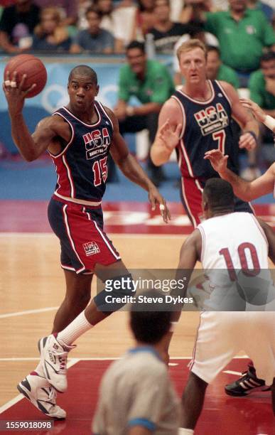 July 4, 1992: Earvin Magic Johnson passes the ball behind his back to Larry Bird of team USA during a game at the 1992 Summer Olympics against Puerto...