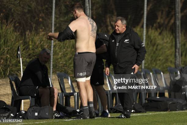 New Zealand's coach Ian Foster talks to Sam Cane during a training session at Xavier College in Melbourne on July 28 ahead of the Rugby Championship...