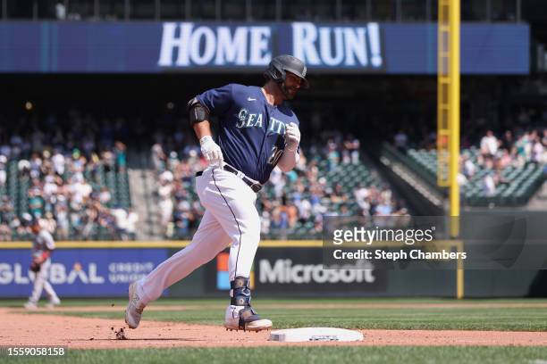 Mike Ford of the Seattle Mariners celebrates his two run home run during the eighth inning against the Minnesota Twins at T-Mobile Park on July 20,...