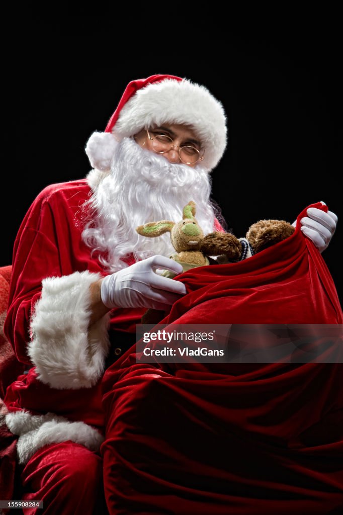 Santa holding a bag of gifts