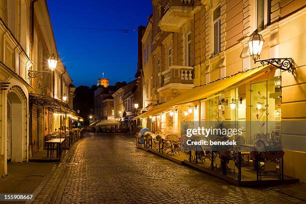 street with restaurants in vilnius, lithuania - vilnius stock pictures, royalty-free photos & images