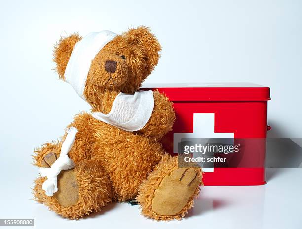 sad teddybear - first aid kit stock pictures, royalty-free photos & images