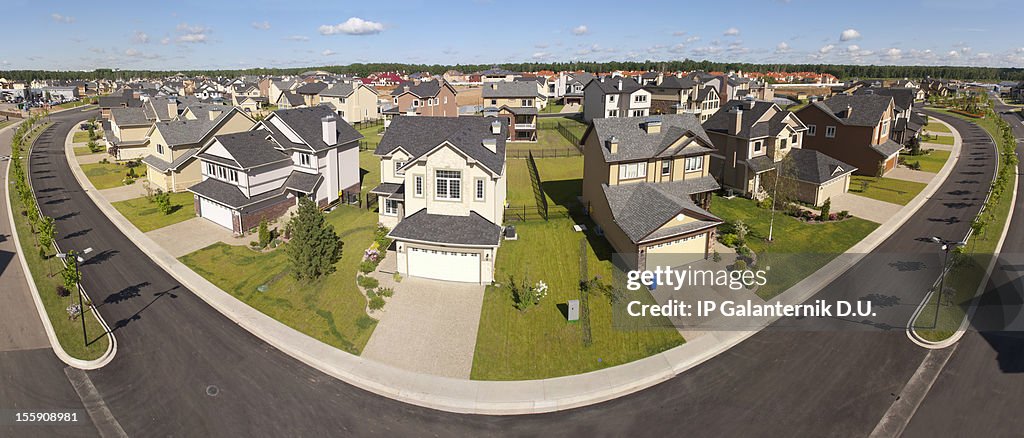 High angle view of suburban houses along a curving street