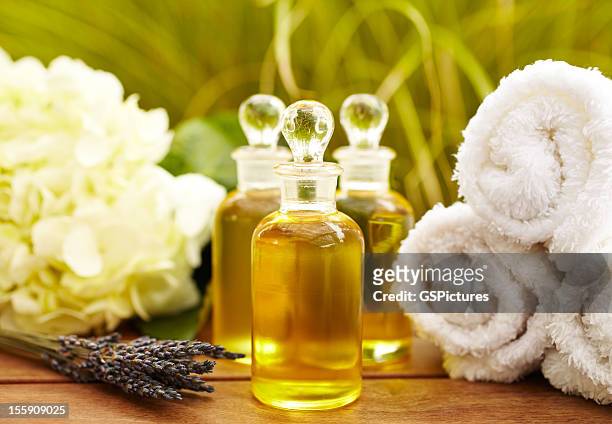 massage oil bottles at spa - massage oil stock pictures, royalty-free photos & images