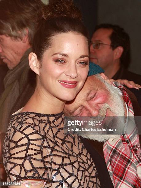 Actress Marion Cotillard and photographer Bruce Weber attend The Cinema Society with Dior & Vanity Fair host a screening of "Rust and Bone" at...