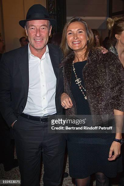 Christophe Chenut, CEO of Lacoste, and his wife attend 'La Petite Veste Noire' Book Launch Hosted By Karl Lagerfeld & Carine Roitfeld at Grand Palais...