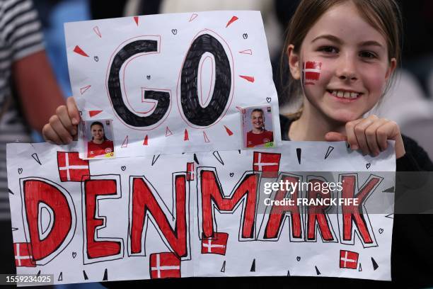 Young supporter of Denmark is seen prior to the Australia and New Zealand 2023 Women's World Cup Group D football match between England and Denmark...