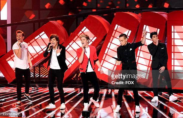 Louis Tomlinson, Harry Styles, Niall Horan, Liam Payne and Zayn Malik of British singing group One Direction performs on FOX's "The X Factor" Season...