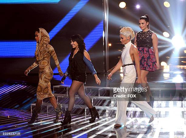 Contestants Paige Thomas, Jennel Garcia and Cece Frey and judge Demi Lovato onstage at FOX's "The X Factor" Season 2 Top 13 To 12 Live Elimination...