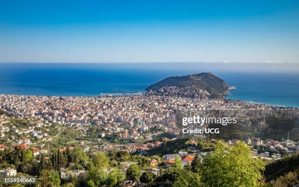 Breathtaking panoramic view of Alanya, Turkey, from the foothills of the majestic Taurus Mountains Toros Mountains), capturing the heart of the...