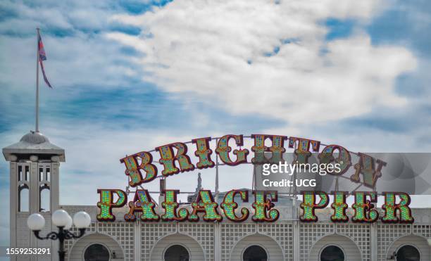 The LED illuminated sign above the historic Brighton Palace Pier in Brighton, East Sussex, UK.âThe pier opened in 1899 and is the last of three piers...