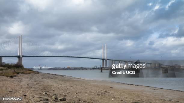View looking westwards on the River Thames towards the Dartford Crossing, or QE2 Bridge, near London, UK.