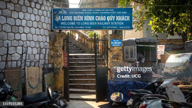 An entrance and steps to Long Bien Railway Station in Hanoi, Vietnam.