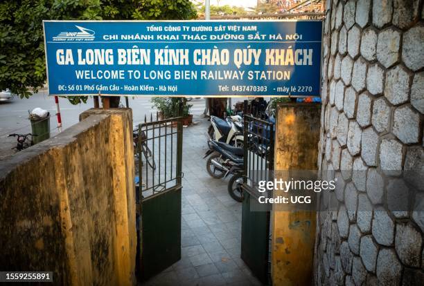 Looking out from an entrance and steps to Long Bien Railway Station in Hanoi, Vietnam.