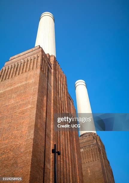 Looking up at the iconic Battersea Power Station, London, UK, a decommissioned Grade II listed coal-fired power station originally commissioned in...