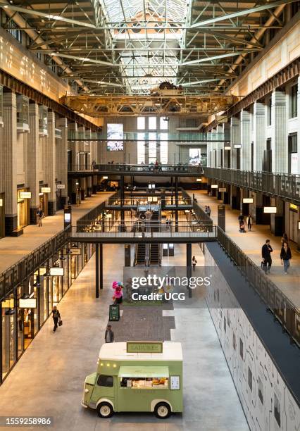 The interior of the old Battersea Power Station in London, UK, that has been redeveloped as a shopping center while retaining original industrial and...