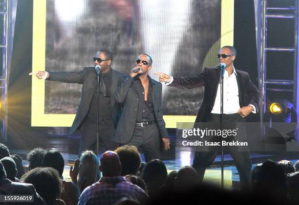 Recording artists Johnny Gill , Ralph Tresvant and Ronnie Devoe of New Edition perform during the Soul Train Awards 2012 at PH Live at Planet...