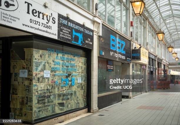 The famous Art Deco style Imperial Arcade in Brighton, UK, lined with empty and abandoned shops. Physical shops businesses suffer from losing...