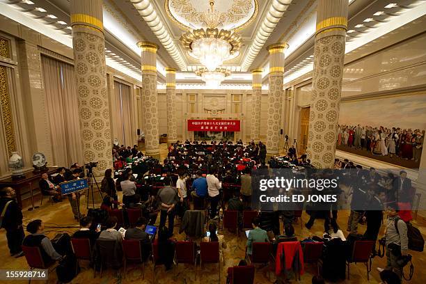 Delegates from China's Hunan province hold a meeting in the Hunan room at the Great Hall of the People in Beijing on November 9, 2012. The week-long...