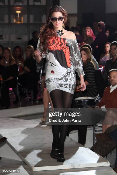 Model walks the runway at the Miami Hair, Beauty & Fashion 2012 By Rocco Donna at Viceroy Hotel Spa on November 8, 2012 in Miami, Florida.