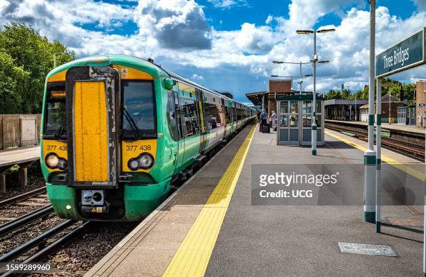 Southern Railway train pulls into Three Bridges Railway Station in West Sussex, UK.