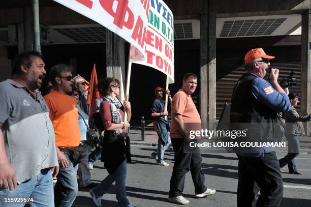 Municipal workers march in central Athens on November 9, 2012 during a protest rally against austerity measures and the expected layoffs in their...