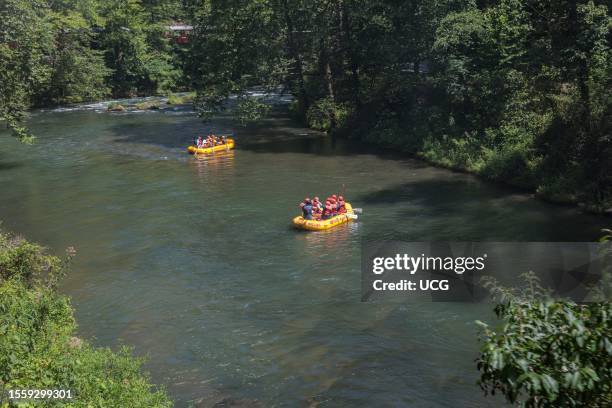 Rafters on the Nantahala River as seen from the Great Smoky Mountains Railroad which runs next to the river during its excursion from Bryson City,...