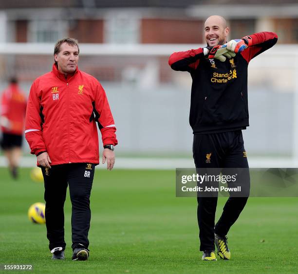 Brendan Rodgers, manager of Liverpool, talks with Pepe Reina during a training session at Melwood Training Ground on November 9, 2012 in Liverpool,...