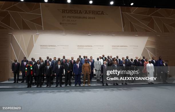 This pool image distributed by Sputnik agency shows Russian President Vladimir Putin, African leaders and heads of delegations posing for a family...