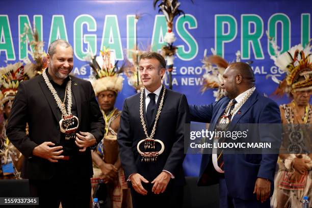 Prime Minister of Papua New Guinea James Marape and France's President Emmanuel Macron meet Managalas people at APEC Haus in Port Moresby on July 28,...