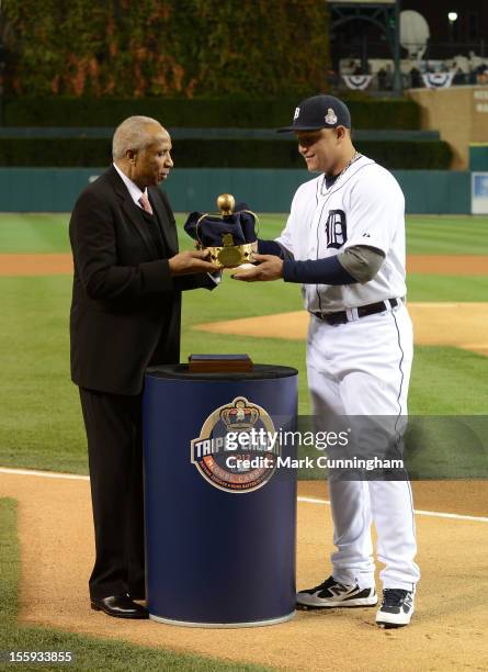 Baseball Hall of Famer and former Triple Crown Award winner Frank Robinson presents the 2012 Triple Crown Award to Miguel Cabrera of the Detroit...