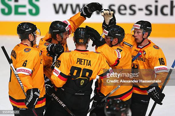 Marcus Kink of Germany celebrates scoring the fisrt goal with his team mates during the German Ice Hockey Cup 2012 first round match between Germany...