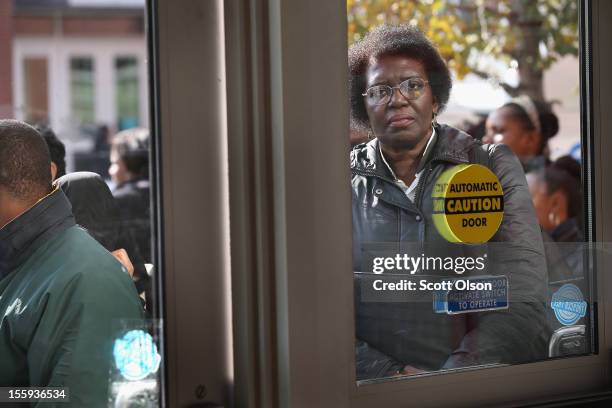 Job seekers wait in line outside Kennedy-King College to attend a job fair hosted by the city of Chicago on November 9, 2012 in Chicago, Illinois....