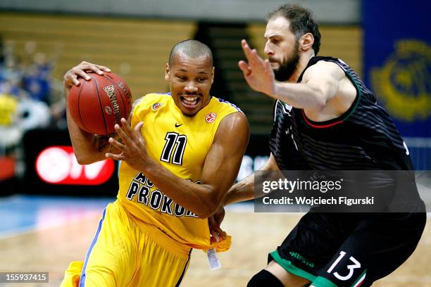 Alex Acker, #11 of Asseco Prokom Gdynia competes with Viktor Sanikidze, #13 of Montepaschi Siena during the 2012-2013 Turkish Airlines Euroleague...