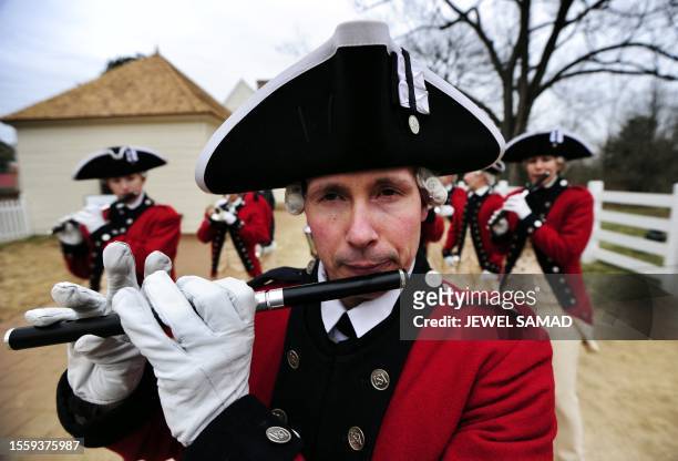 Men dressed as Continental Army band play music during a "Serprise Birthday Pary" to celebrate George Washington's Birthday in Mount Vernon,...