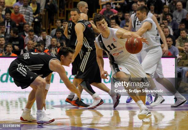 Vladimir Lucic of BC Partizan competes with Casey Jacobsen of Brose Baskets Bamberg during the 2012-2013 Turkish Airlines Euroleague Regular Season...