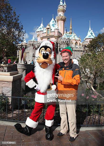 In this handout image provided by Disney Parks, actor Will Ferrell, star of the popular holiday film "Elf," dons a Mickey Mouse-inspired Elf hat and...