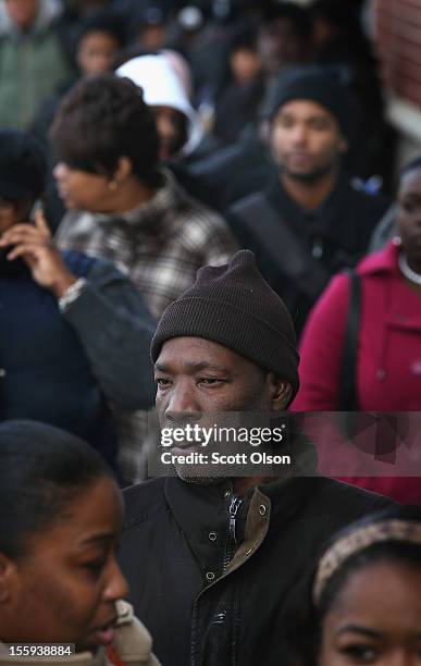 Job seekers wait in line at Kennedy-King College to attend a job fair hosted by the city of Chicago on November 9, 2012 in Chicago, Illinois....