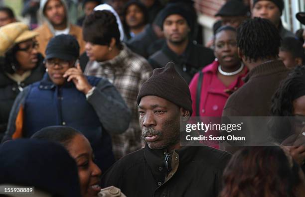 Job seekers wait in line at Kennedy-King College to attend a job fair hosted by the city of Chicago on November 9, 2012 in Chicago, Illinois....