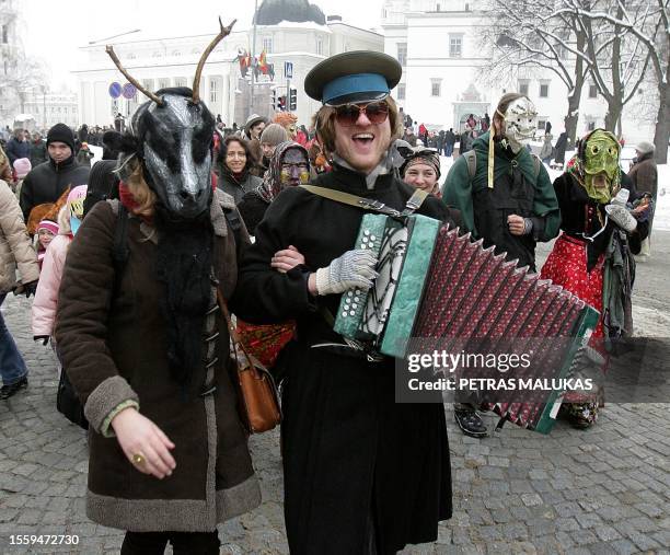 People celebrate 'Uzgavenes' dressed as gypsies, horses, goats in the old town of Vilnius, on February 16, 2010. 'Uzgavenes' is held before the...