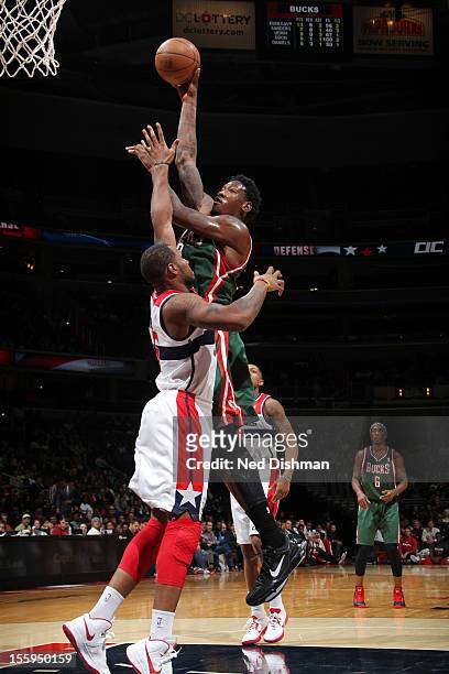 Larry Sanders of the Milwaukee Bucks shoots against Trevor Booker of the Washington Wizards during the game at the Verizon Center on November 9, 2012...