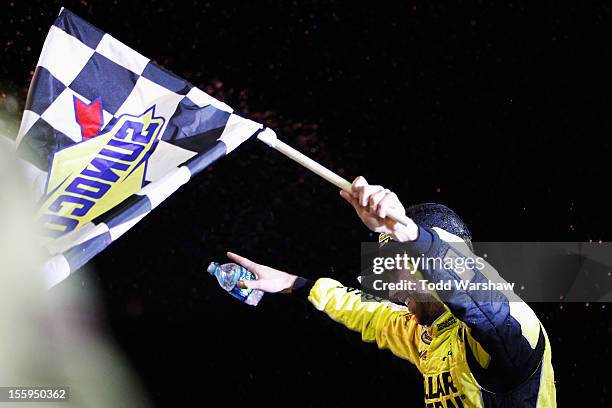 Brian Scott, driver of the Dollar General Toyota, celebrates in victory lane after winning the NASCAR Camping World Truck Series Lucas Oil 150 at...