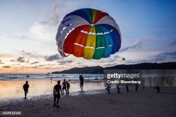 Parasailing on Patong beach in Phuket, Thailand, on Thursday, July 6, 2023. Russian nationals were the No. 1 source of tourists to the island this...